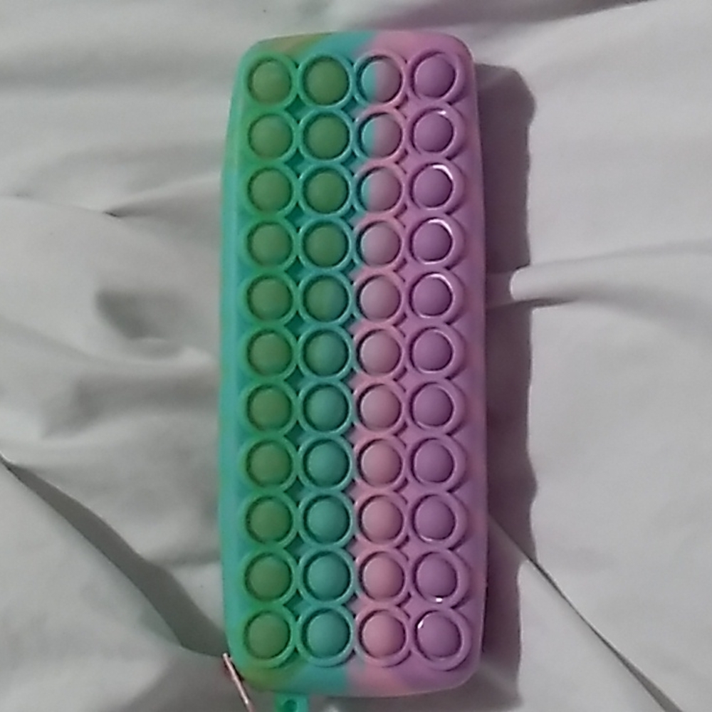 8 x 3 x 1 1/4 inches Purple, pink & green Pop It Case